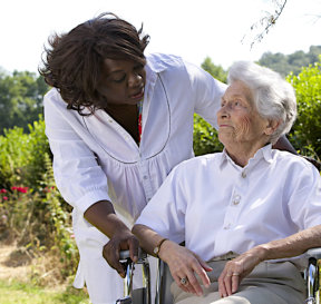 caregiver talking to senior woman