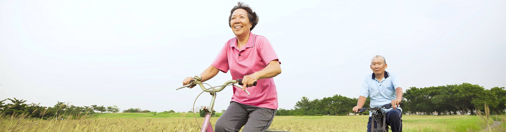 senior man and woman biking