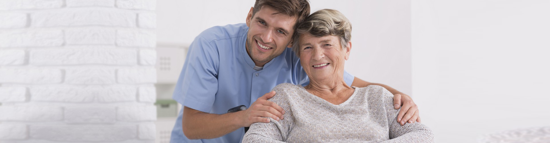 caregiver and senior woman smiling